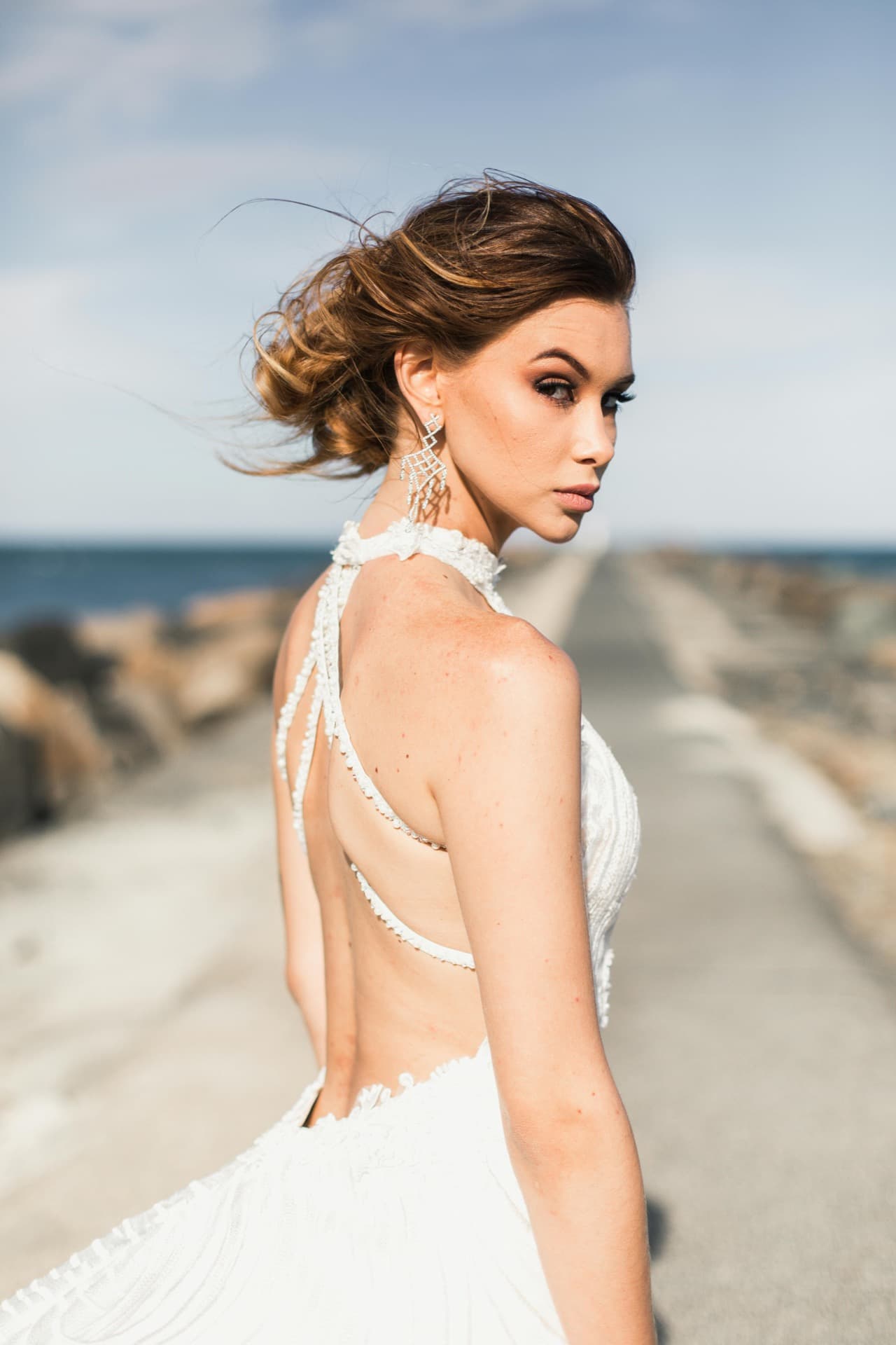Bride and bridesmaids in silk robes celebrating with champagne