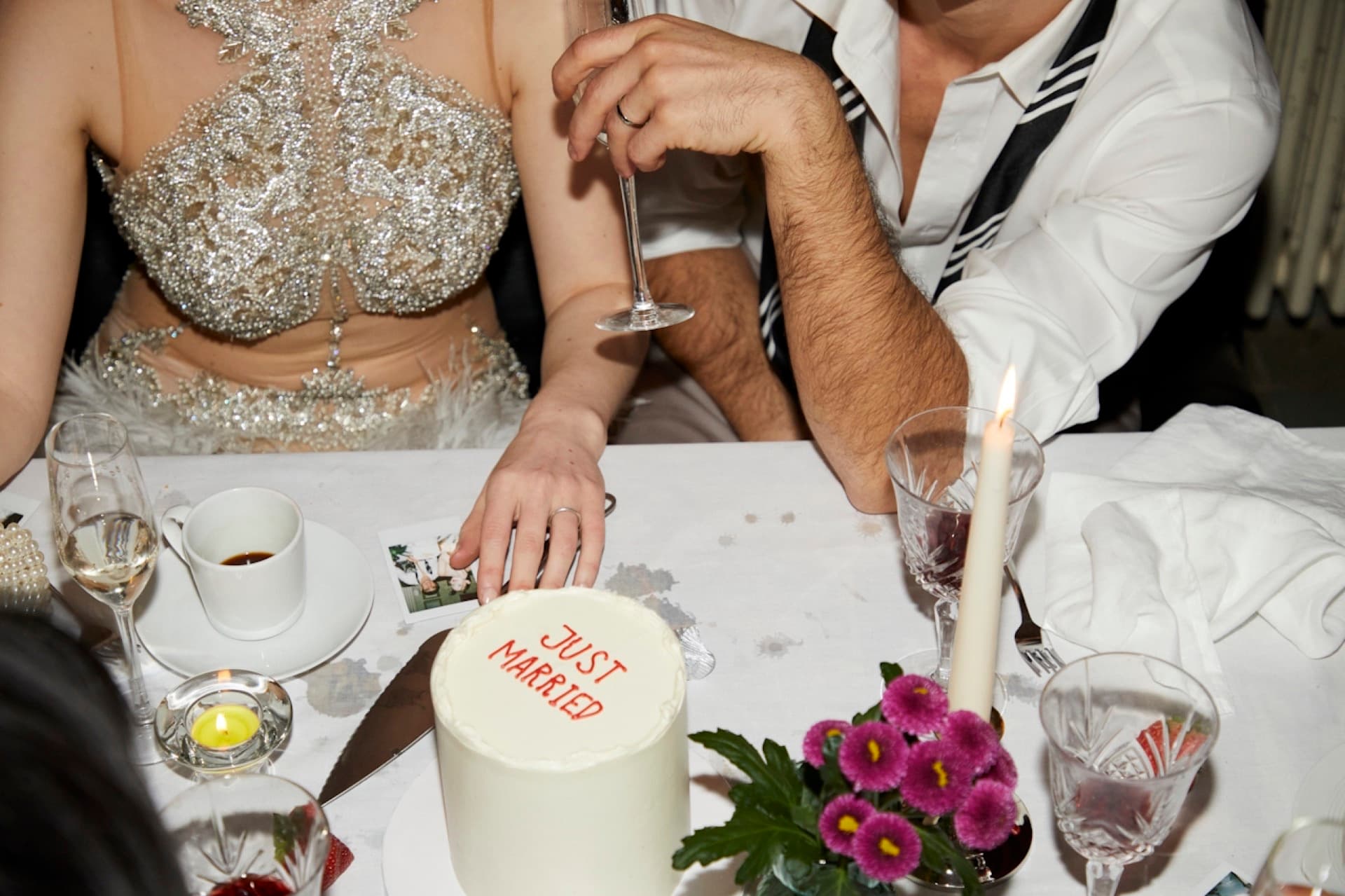 Bride and groom toasting with champagne coupes and bouquet