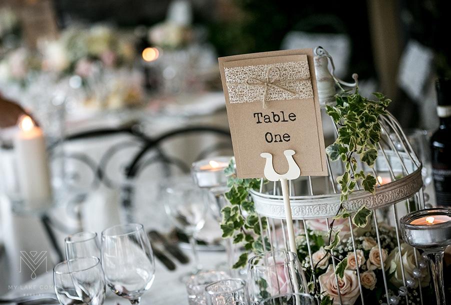 Bird cage wedding dinner table display with flowers and pearls - 15 Memorable Tablescape Ideas For Your Wedding - The National Wedding Directory